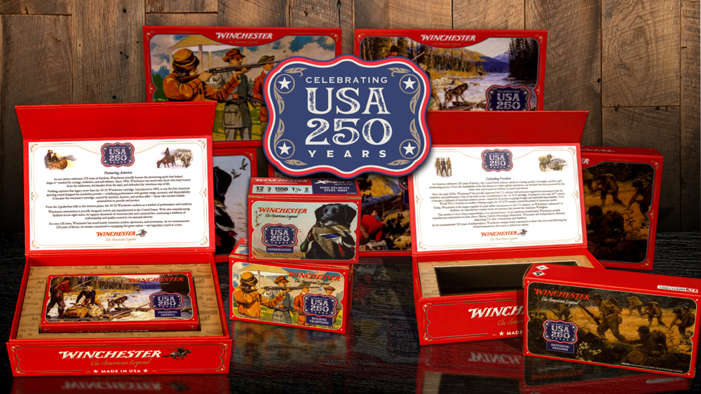 Winchester USA 250th Anniversary Edition ammunition boxes, rounds and shells on a wood table.