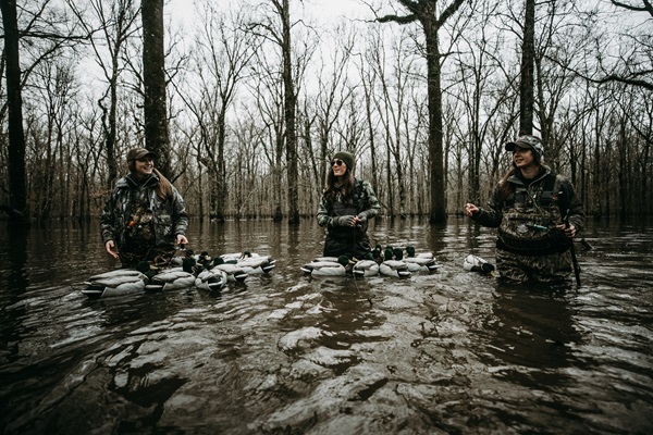 Waterfowlers picking up decoys